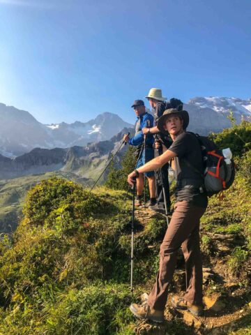 A group of people backpacking in the Alps.