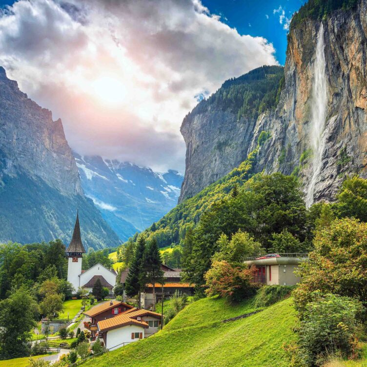 A church with the Staubbach waterfall in the background.