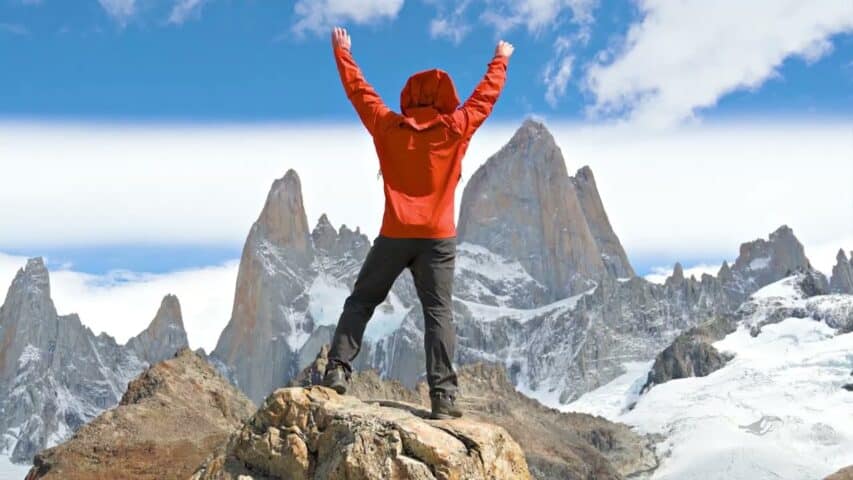 A hiker jumping.