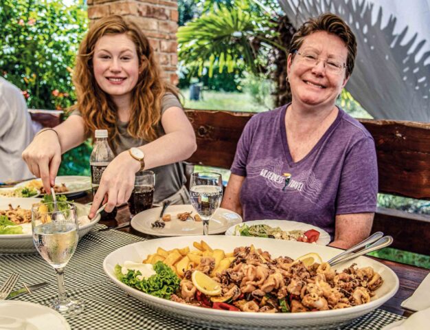 Two women enjoying a meal in Croatia.