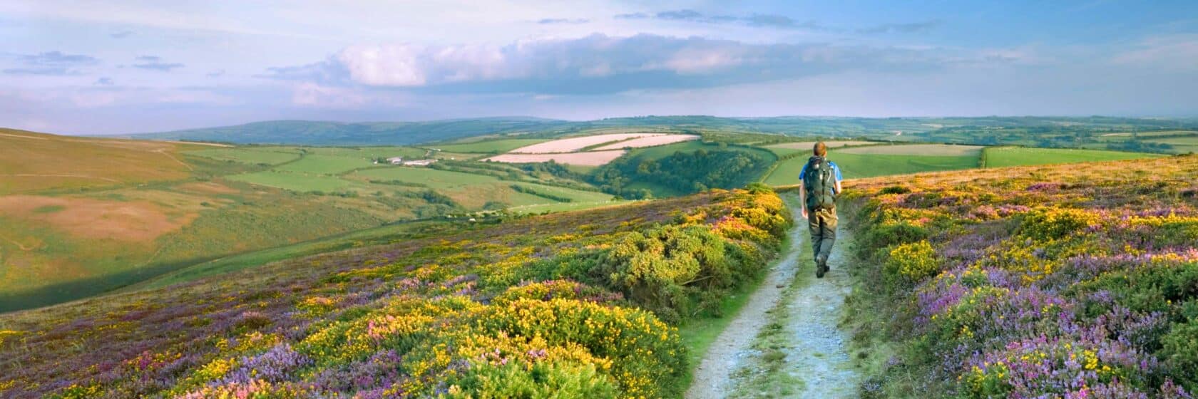 A person hiking the South West Coast Path on Great Hangman in Exmoor National Park.