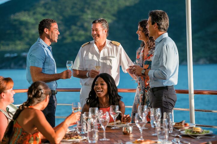 A group of people enjoying a meal together outside in Fiji.