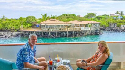 A couple enjoying a meal together on a boat in the Galápagos Islands.