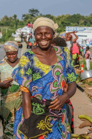 A woman in Ghana, smiling.