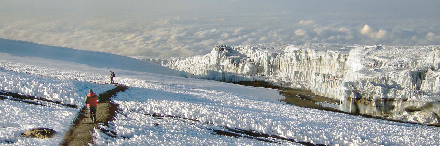 Mountain climbers pass the glacier fields of Furtwangler on Mount Kilimanjaro.