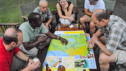 A group of travelers examining a map together.