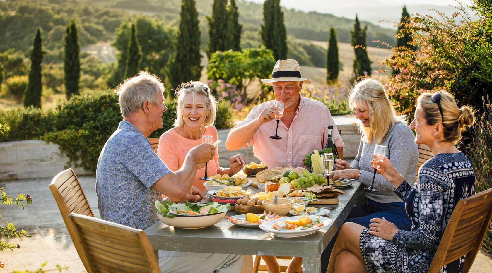 A group of friends enjoying a meal together outdoors.