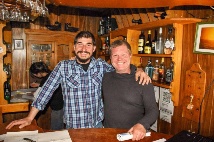 Two men in a lodge.