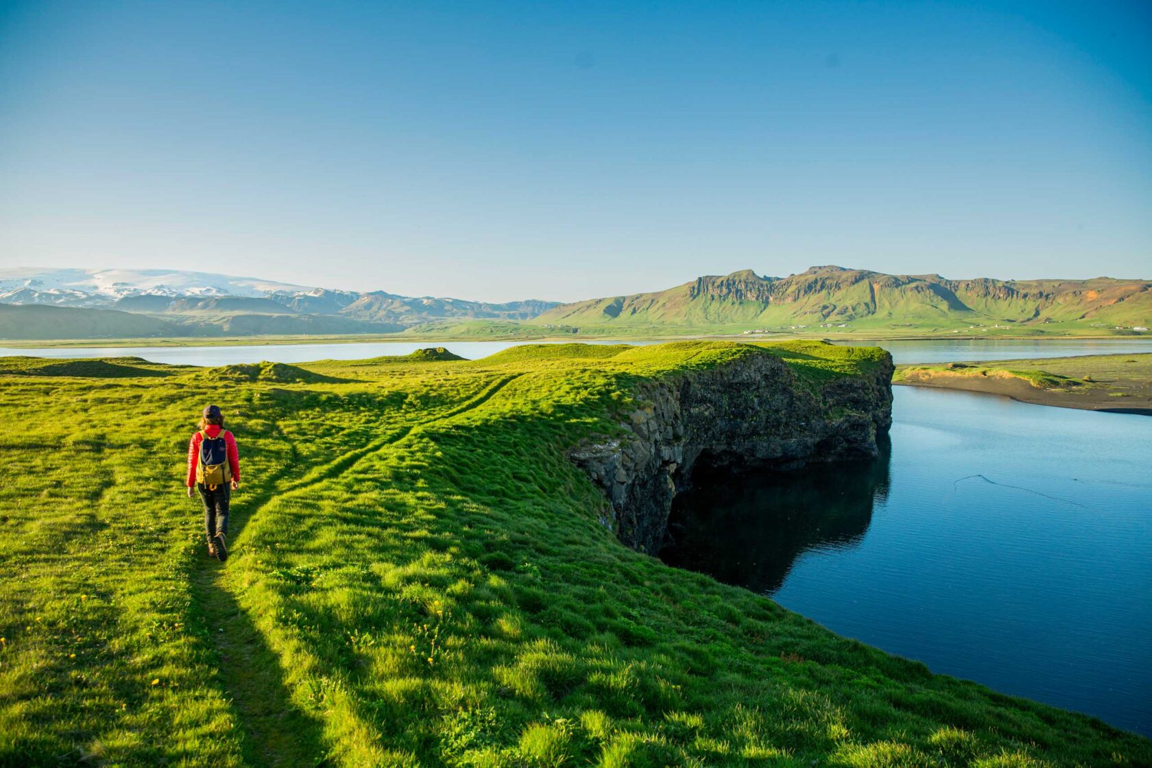 A traveler walking along a cliff.